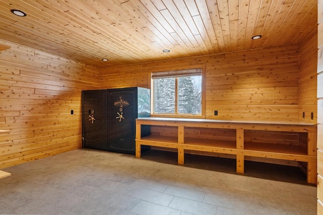 bedroom with wood walls, wood ceiling, and recessed lighting