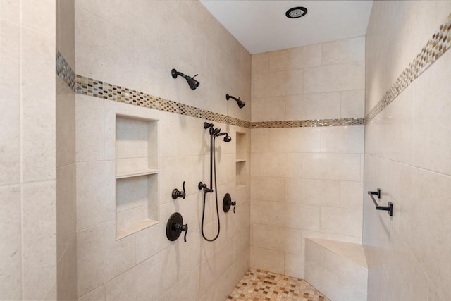 bathroom featuring tiled shower