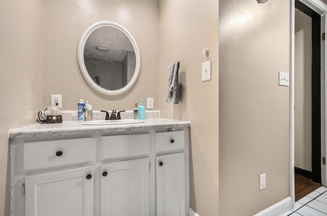 bathroom featuring vanity and baseboards