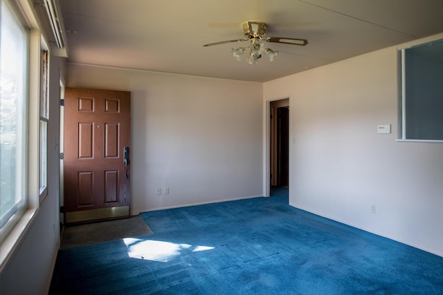 carpeted empty room with ceiling fan