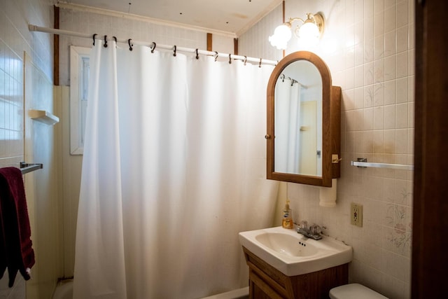 full bathroom with toilet and vanity