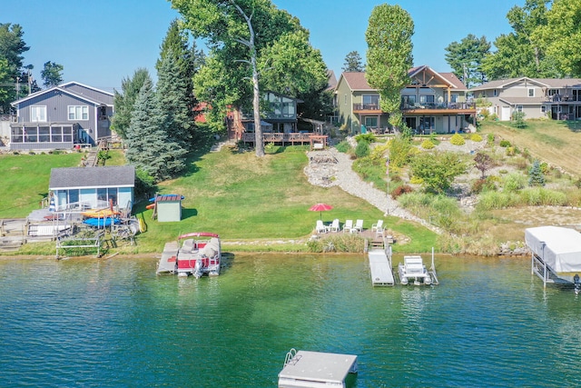 dock area featuring a water view and a residential view