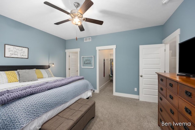 bedroom featuring light carpet, baseboards, visible vents, and ceiling fan