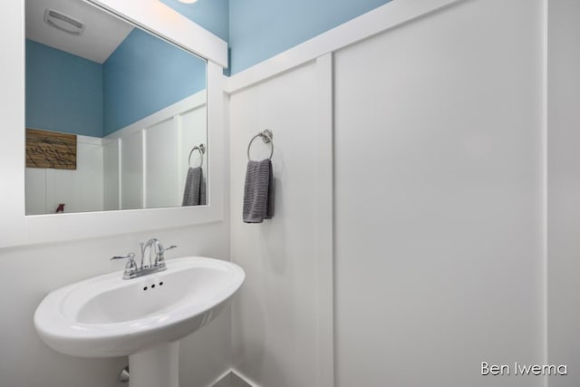 bathroom featuring visible vents and a sink