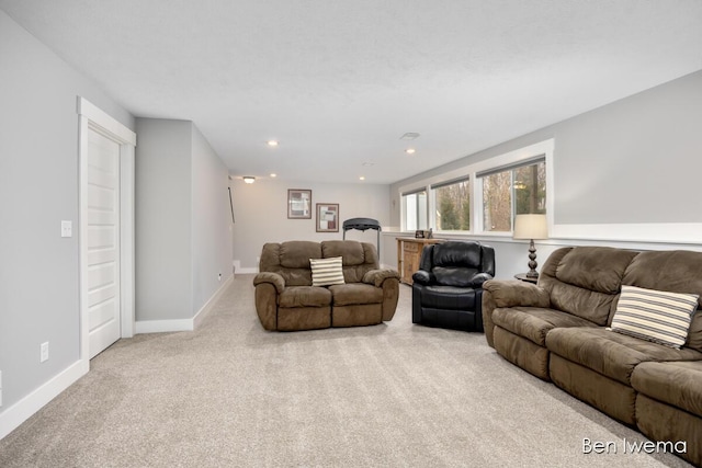 carpeted living room with baseboards and recessed lighting