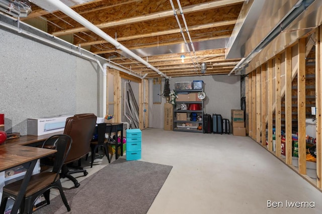 unfinished basement featuring electric panel