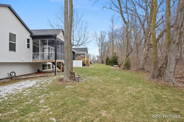 view of yard featuring stairway and a sunroom