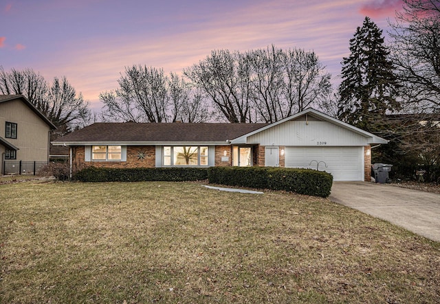 ranch-style home featuring brick siding, a front yard, fence, a garage, and driveway