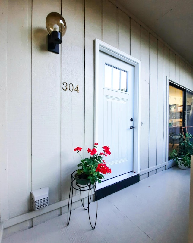 entrance to property featuring board and batten siding