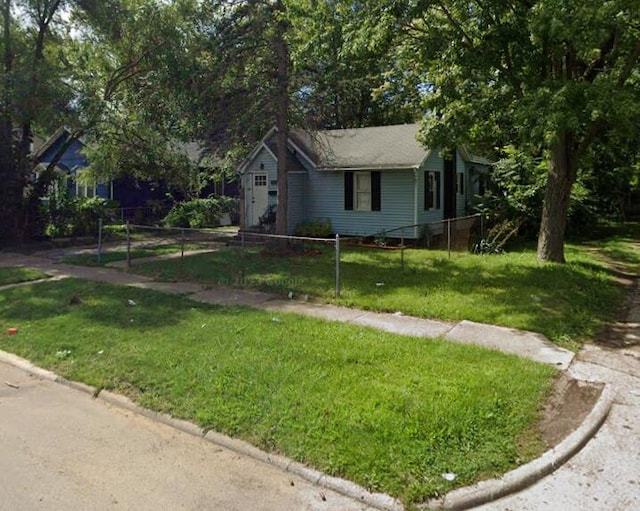 view of front of house with a front lawn and fence private yard