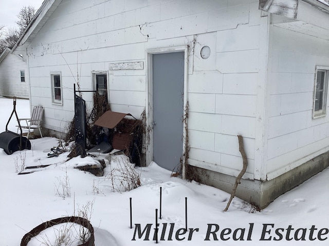 view of snow covered property