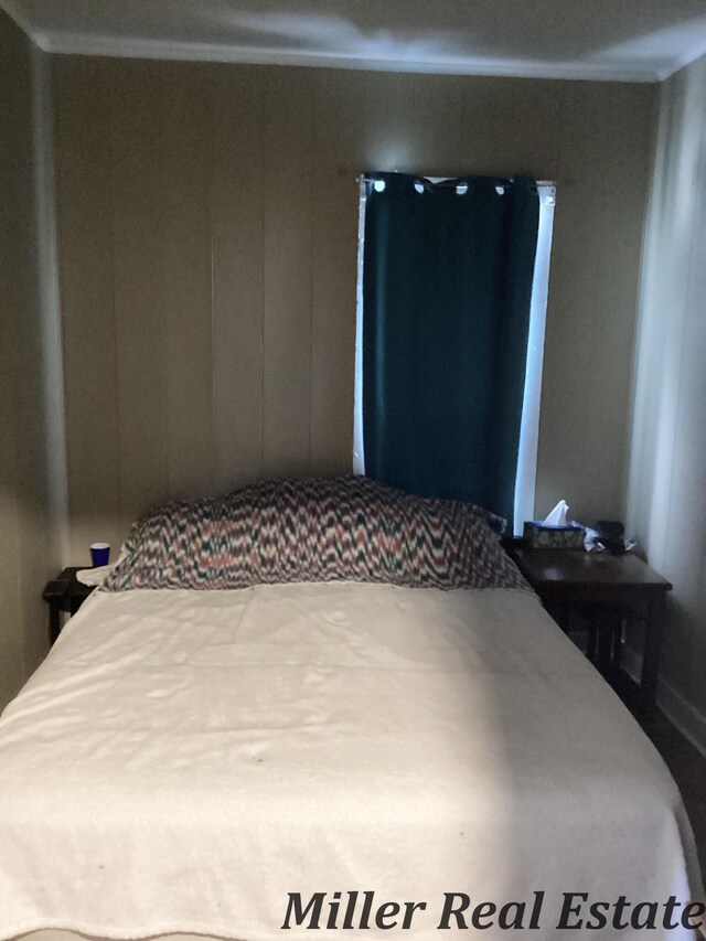 bedroom featuring crown molding