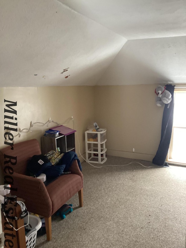 playroom with vaulted ceiling, carpet floors, and baseboards