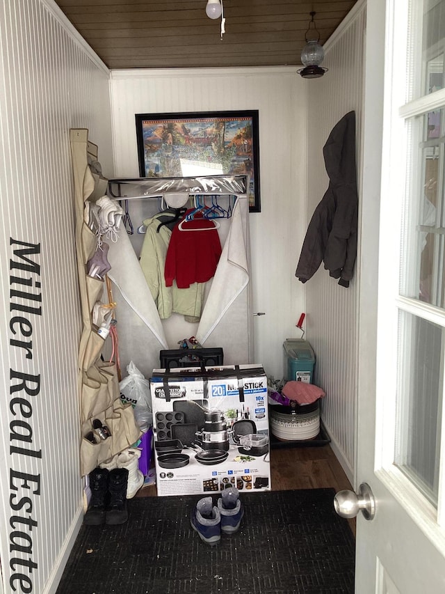 mudroom featuring baseboards and wood finished floors