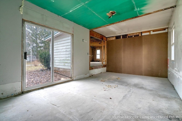 spare room with concrete floors