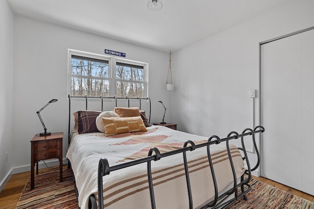 bedroom with a closet and wood finished floors