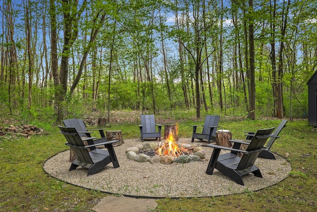 view of yard with a fire pit