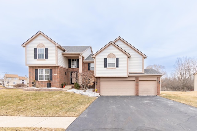 view of front of property featuring driveway, a front lawn, roof with shingles, an attached garage, and brick siding