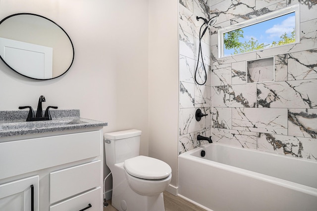 1430 W Laketon Ave, Muskegon, MI 49441 - full bath with toilet, vanity, shower / bathtub combination, and wood finished floors