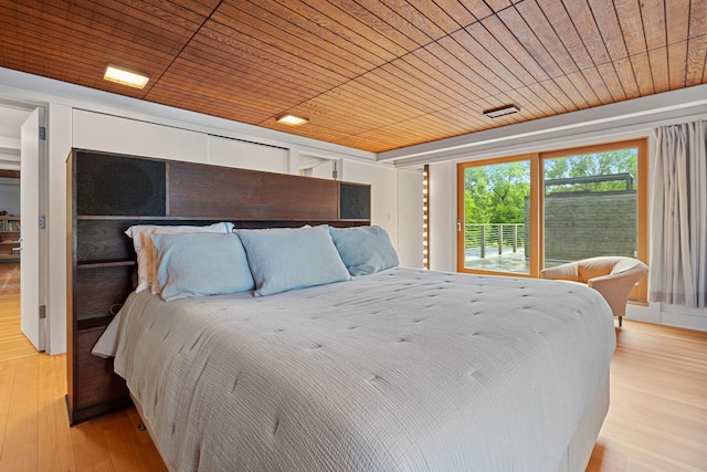 bedroom with wooden ceiling and light wood-style floors