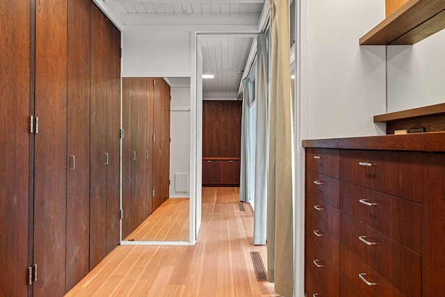 corridor with light wood-style floors