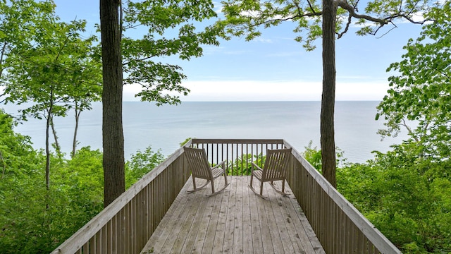 wooden deck with a water view