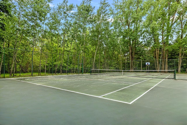 view of sport court with fence