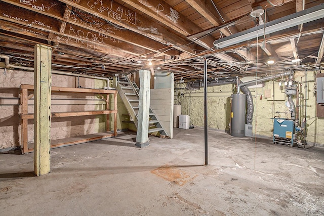 unfinished below grade area featuring a heating unit, electric panel, water heater, and stairway