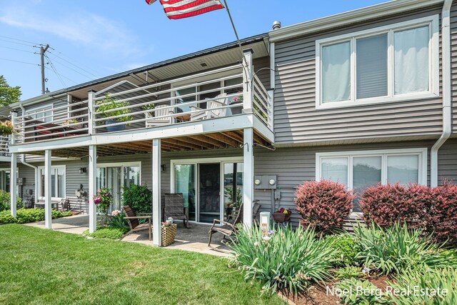 606 Edgewater Ct, Spring Lake, MI 49456 - back of house with a lawn, a patio area, and a balcony