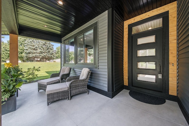 entrance to property featuring covered porch