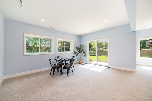 dining room featuring light carpet, recessed lighting, visible vents, and baseboards