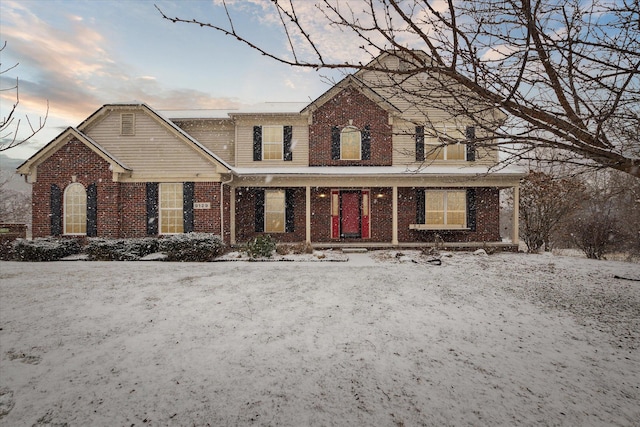 traditional-style home featuring brick siding