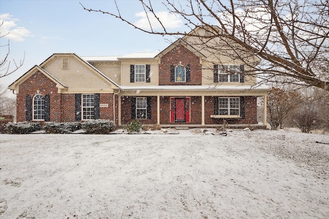 traditional home featuring brick siding