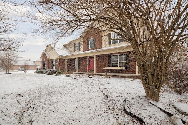 traditional-style home with brick siding