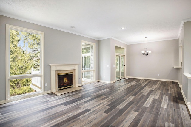 unfurnished living room featuring a chandelier, a fireplace, dark wood finished floors, and baseboards