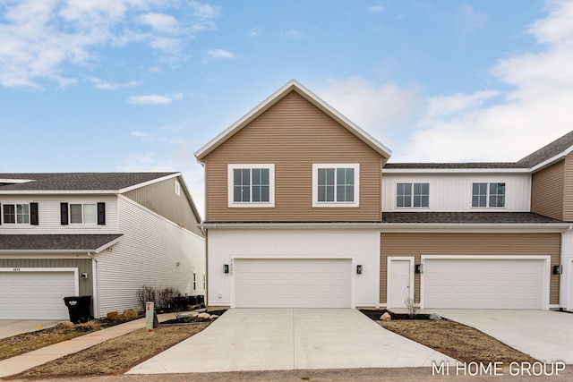 view of front of home featuring driveway and a garage