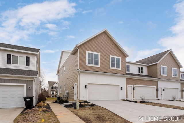 view of front of house with a garage, central air condition unit, and concrete driveway