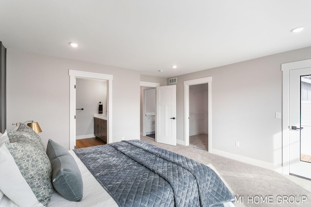 bedroom with carpet flooring, recessed lighting, baseboards, and visible vents