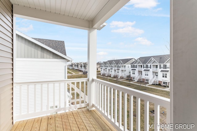 wooden terrace with a residential view