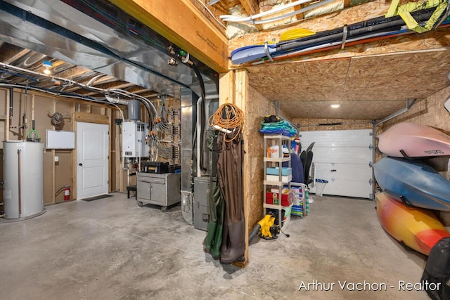 unfinished basement featuring a garage, gas water heater, and tankless water heater