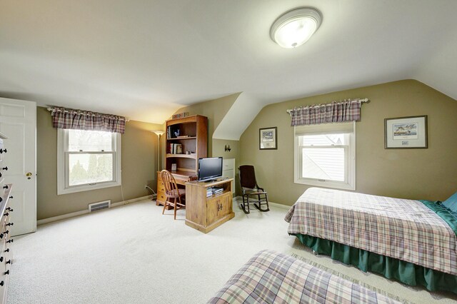 bedroom featuring vaulted ceiling, carpet, visible vents, and baseboards