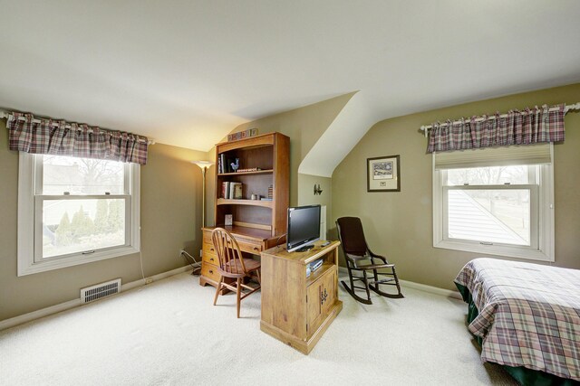 bedroom with light colored carpet, visible vents, lofted ceiling, and multiple windows