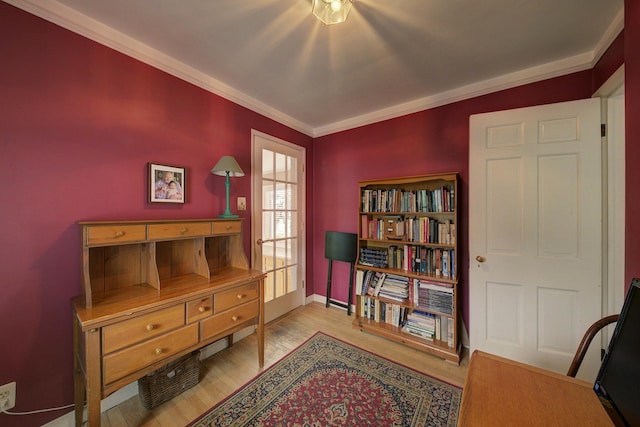 living area with crown molding and wood finished floors