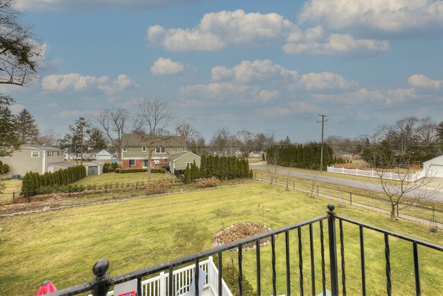 view of yard featuring a rural view and fence