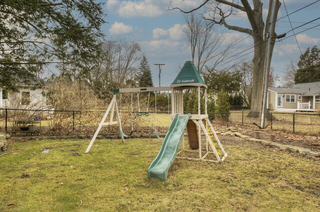 view of playground with fence and a yard