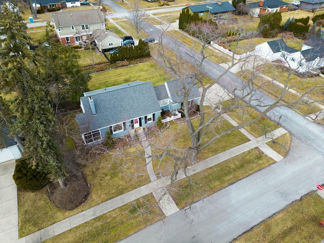 birds eye view of property with a residential view