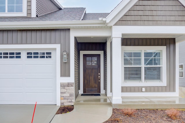 entrance to property with stone siding and roof with shingles