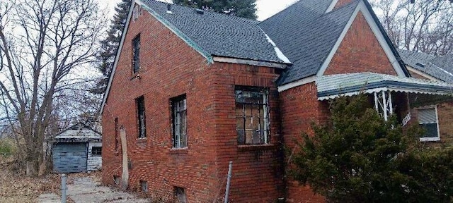 view of side of property featuring brick siding