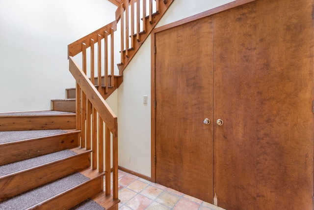 stairs featuring baseboards