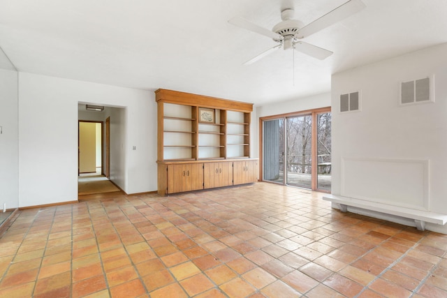 unfurnished living room with a ceiling fan, baseboards, and visible vents